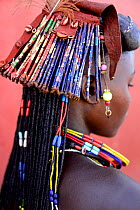 Ovakahaona woman with ostrich feather and ornaments in hair, Okongwati village, Kaokoland, Namibia, September 2013.