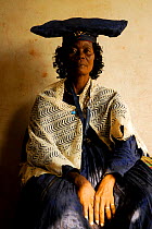 Herero woman in traditional dress - influenced by Victorian missionaries, Kaokoland, Namibia. February 2005