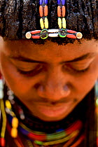 Ovahakaona woman showing her ??hair with traditional ornaments. Kaokoland, Namibia.