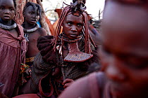 Group of Himba women and children at the village at dawn. Kaokoland, Namibia, September 2013.