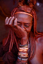 Himba woman snorting snuff tobacco. Kaokoland, Namibia, September 2013.