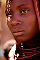 Himba woman with a metal ornament in her hair, Kaokoland, Namibia, September 2013.