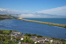 View from Torcross to Slapton Ley National Nature Reserve with sea mist, Devon, England, UK, July.