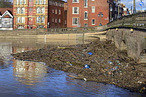 Flotsam from flooding along the River Severn trapped against Worcester Bridge, Worcester, England, UK, February 2014.