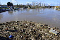 Flotsam from flooding along the River Severn trapped against Worcester Bridge, Worcester, England, UK, February 2014.
