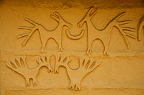 Animal relief sculptures on mud of house wall, in indigenous Tharu village, Terai, Bardia National Park, October 2011.