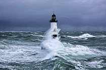 Rough seas at d'Ar-Men lighthouse during Storm 'Ruth', Ile de Sein, Armorique Regional Park. Iles du Ponant, Finistere, Brittany, France, Iroise Sea. 8th February 2014.  France, Bretagne, Finistere,...