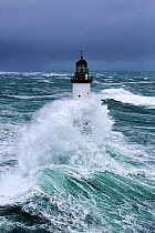 Rough seas at d'Ar-Men lighthouse during Storm 'Ruth', Ile de Sein, Armorique Regional Park. Iles du Ponant, Finistere, Brittany, France, Iroise Sea. 8th February 2014.~~France, Bretagne, Finistere, M...