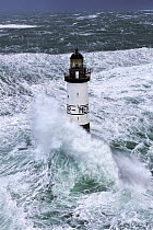 Rough seas at d'Ar-Men lighthouse during Storm 'Ruth', Ile de Sein, Armorique Regional Park. Iles du Ponant, Finistere, Brittany, France, Iroise Sea. 8th February 2014.  France, Bretagne, Finistere,...
