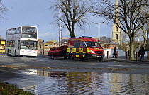 Shuttle bus with rescue vehicle and RIB boat during record breaking floods, New Road, Worcester, England, UK, 13th February 2014.