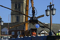 Crane removing trees from debris raft trapped by Worcester Bridge due to record floods, Worcestershire, England, UK. 16th February 2014.