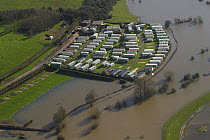 Small caravan park  surrounded by flood water from the River Severn during February 2014 flooding, Worcestershire, England, UK, 7th February 2014.