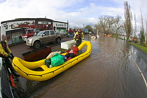 Inflatable raft with rescued resident during February 2014 floods, Upton upon Severn, Worcestershire, England, 10th February 2014.
