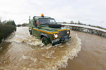 Mercia Rescue Landrover driving through flood waters to help home owners during February 2014 floods, 9th February 2014.