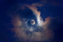 Full moon behind clouds, seen from Norfolk, England, UK, January 2010.