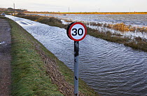View of flooding on a coastal road after the 6th December east coast tidal surge, Cley, Norfolk, England, UK, December 2013.