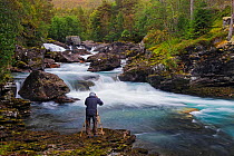 Photographer Heini Wehrle working on the  Valldola River near Gudbrandsjuvet, Gudbrandsjuvet, Norway. September. Model released.
