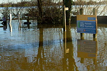 Car park with footpath signs, during January 2014 floods, Langport, Somerset, UK, England, UK, 11th January 2014.