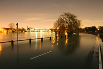 Flooded road in Weybridge along the River Thames at night. Surrey, England, 13th February 2014.