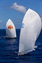 Two mega yachts with white spinnakers racing in the 2013 St. Barths Bucket Regatta, March 2013, Caribbean. All non-editorial uses must be cleared individually.
