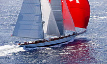 Mega yacht 'Adela' under spinnaker racing in the 2013 St. Barths Bucket Regatta, Caribbean, March 2013. All non-editorial uses must be cleared individually.
