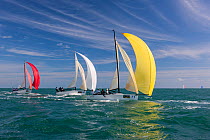 Three colorful spinnakers racing during 2013 Key West Race Week, Florida. All non-editorial uses must be cleared individually.