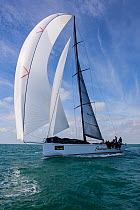 Sailing boat with wind in sails during 2013 Key West Race Week, Florida. All non-editorial uses must be cleared individually.