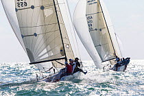 Two boats racing with spinnakers out during Key West Race Week 2013, Florida. All non-editorial uses must be cleared individually.