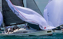 Spinnaker take down at Key West Race Week 2013, Florida. All non-editorial uses must be cleared individually.