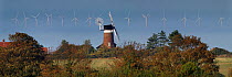 Windmill and North Sea wind farm, Weybourne, Norfolk, UK, October 2013.