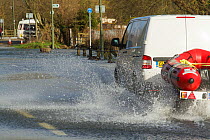 Rescue vehicle with rib to transport residents during February 2014 floods. Chertsey, Surrey, England, UK, 16th February 2014.