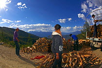Fish eye view of people collecting firewood, Daocheng City, Sichuan Province, China, July 2010.