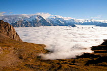 View south from near Faulhorn (2680m) across a cloud filled Grindelwald valley towards the Eiger (3970m) and Jungfrau (4158m), Bernese Oberland alpine region, Switzerland, October 2013.