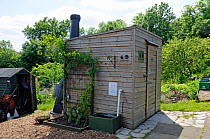 Compost toilet or lavatory with ventilation pipe showing at rear, Alexandra Palace Allotments, London Borough of Haringey, UK, June 2013.