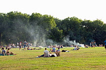 Smoke from barbecues polluting the environment over Highbury Fields on a hot summers day, London Borough of Islington, England, UK, September 2012.