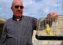 Albert Dimech, with pet Canary (Serinus canaria) Malta, March 2012.