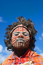 Kikuyu warrior wearing headress made of Helmeted Guineafowl (Numida meleagris) feathers, Tomson Falls, Kenya. August 2010.