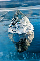 Ice fragment reflected in ice of Lake Baikal, Siberia, Russia, March.