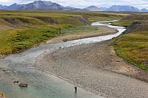 A Chukchi boy fishing for Grayling in the Matachingay River. Iultinsky District, Chukotka, Siberia, Russia, August 2013.