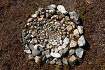 A circular pattern of small stones on the ground at a Chukchi reindeer herder's camp symolises the reindeer herd. The Chukchi believe that these carefully selected and positioned stones will help keep...