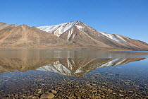 Mountains of the Chukotskiy Range reflected in a mountain lake. Amguema, Iultinsky District, Chukotka, Siberia, Russia, September 2013.