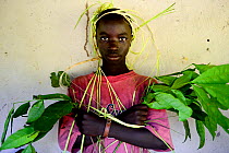Man in ceremonial head dress of palm leaves at traditional wedding in the village of Ambeduco, Orango Island, Guinea Bissau, December 2013.