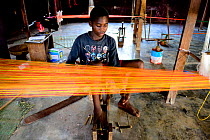 Man weaving on loom in Quinhamel, Guinea-Bissau, December 2013.