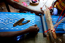 Villagers weaving on loom in Quinhamel, Guinea-Bissau, December 2013.