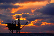 Sun setting at the Eider Platform, 60 miles northeast of Shetland, North Sea, November 2013. All non-editorial uses must be cleared individually.