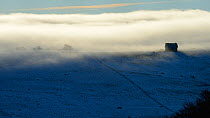 Clouds over snowy landscape, Plateau d'Aubrac in winter, Lozere, Auvergne, France, December 2013