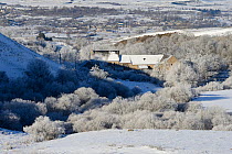 Snowy town landscape, Plateau d'Aubrac in winter, Lozere, Auvergne, France, December 2013
