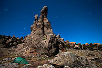 Photographer's tent under the stars and granite cliffs of Rafu. Bale Mountains National Park, Ethiopia, December 2011.