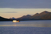 Fishing boat at mouth of Dog Salmon River, Olga Bay, Kodiak Island, Alaska, USA, August 2013.