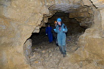 Dr. Fiona Mathews leads a survey team exploring old Bath stone mine in search of hibernating Greater horseshoe bats (Rhinolophus ferrumequinum), Bath and Northeast Somerset, UK, January. Model release...